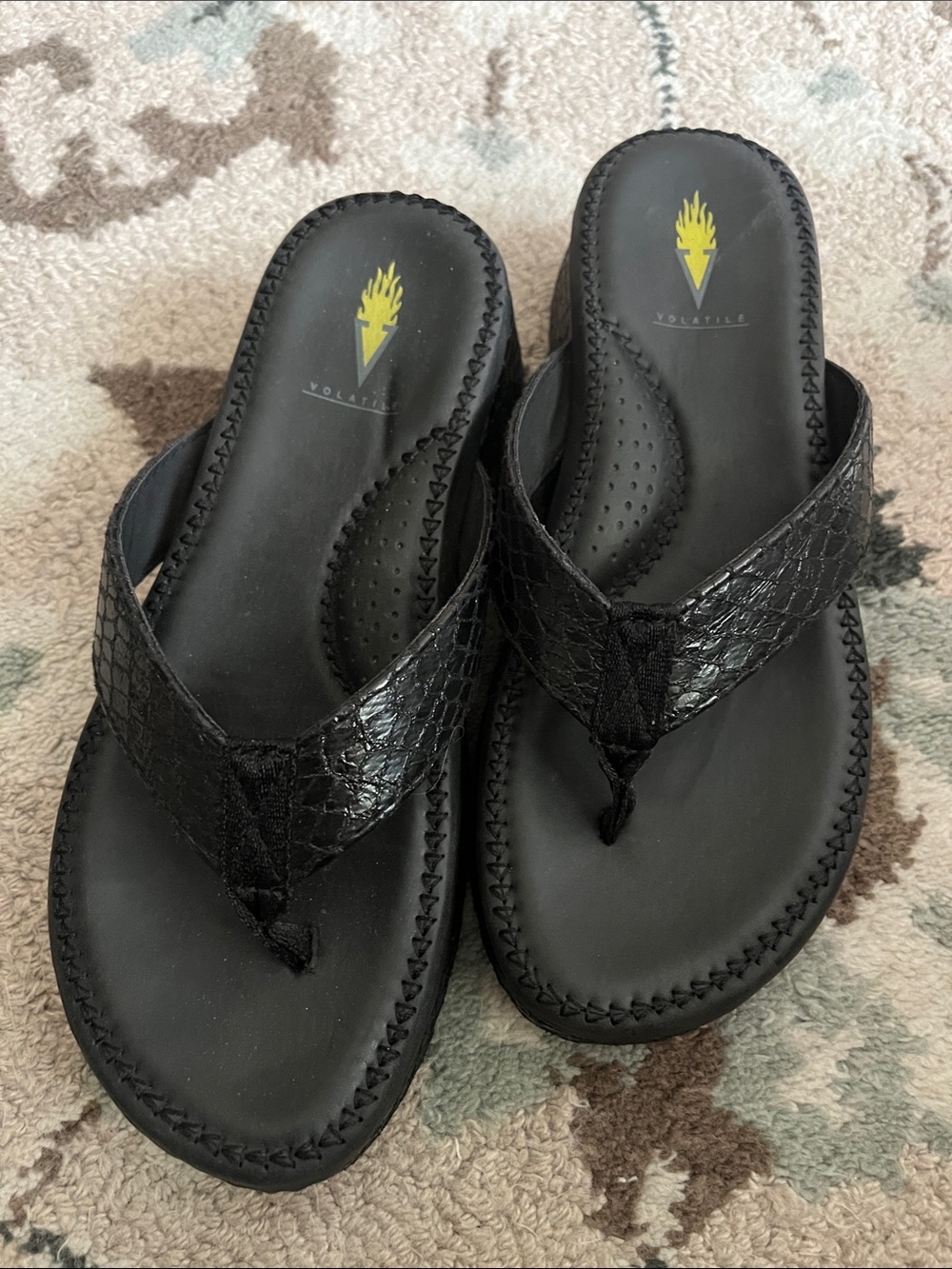 Volatile Black Textured Thong Sandals with Yellow Logo Accent